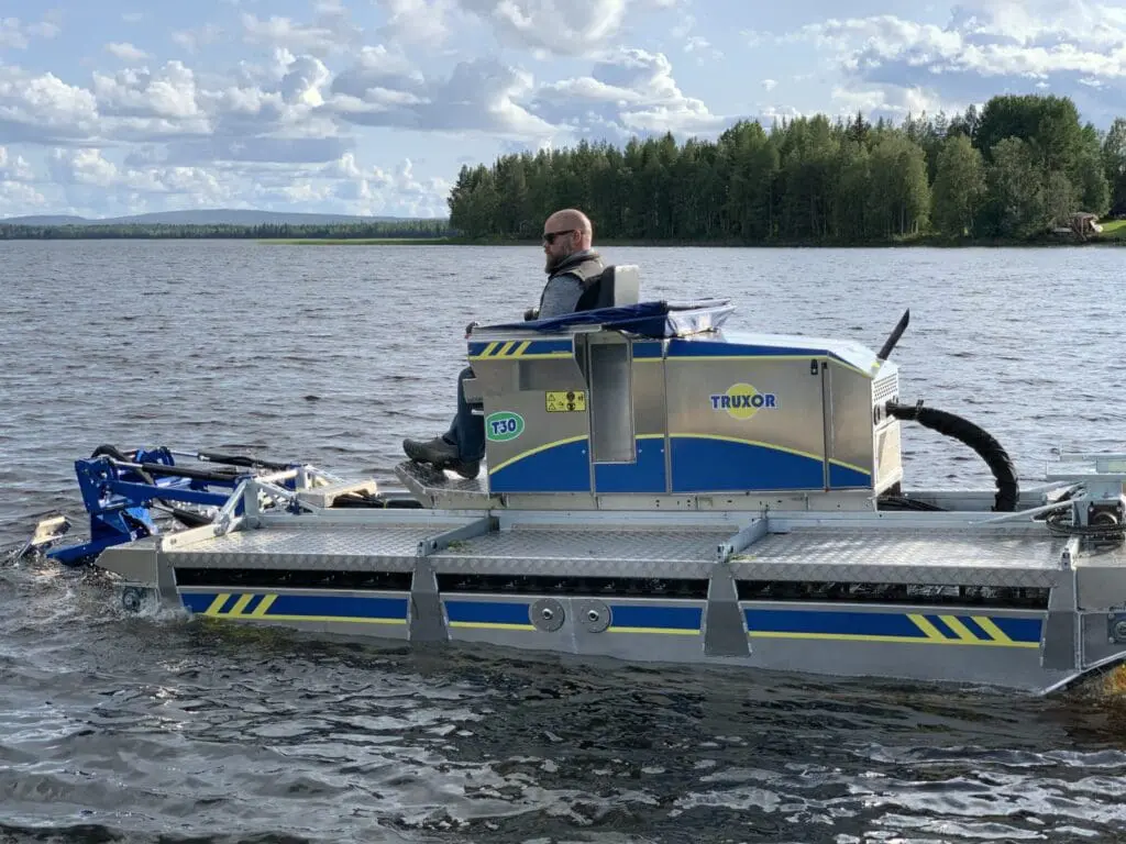 Trent Lewis operating a Truxor T30 amphibious machine on a pond
